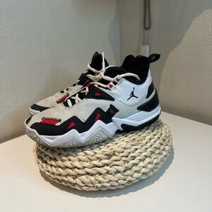 Youth red and black Jordan sneakers